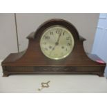 An Edwardian mahogany Napoleon hat mantle clock with silvered Arabic dial and twin winding holes and