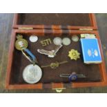 A mixed lot of badges, coins, a Coronation medal and Sankyo musical lighter, to include an 1875