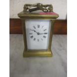 A French brass cased, five window carriage clock with key