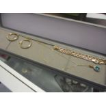 9ct gold jewellery to include a pair of hoop earrings, and a fine chain 3.9g, and a silver gilt