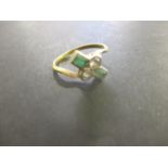 A gold coloured metal ring set with diamonds and emeralds, stamped, Plat 18, 3.15g