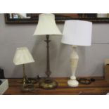 Three vintage lamps to include a carved gilt mahogany table lamp with acanthus ornament, an