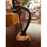 A Victorian grand tour model of a harp on a veined marble base