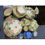 A modern floral painted breakfast set and dinner service, together with a Japanese egg shell part