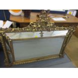 A Victorian gilt plaster framed mirror with grape decoration 45" x 57"