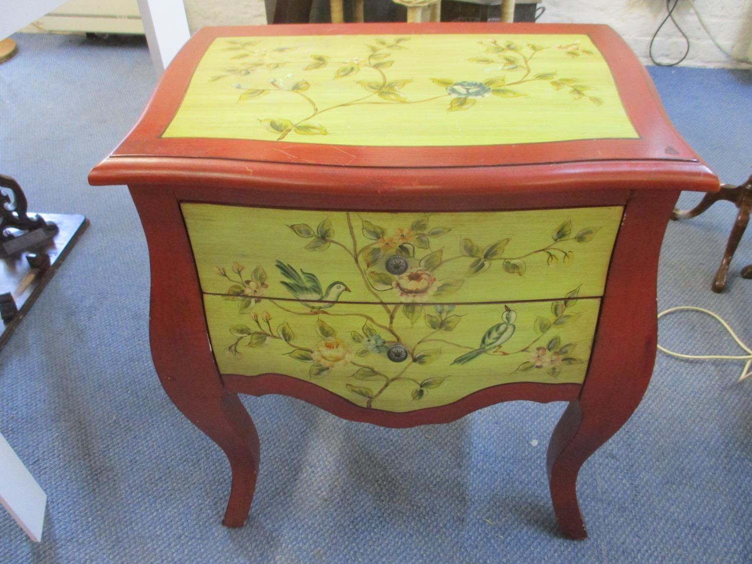 A painted serpentine fronted chest of two drawers