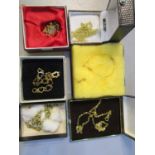 A group of 9ct gold and yellow metal necklaces and bracelets, total weight 26.2g and a 750