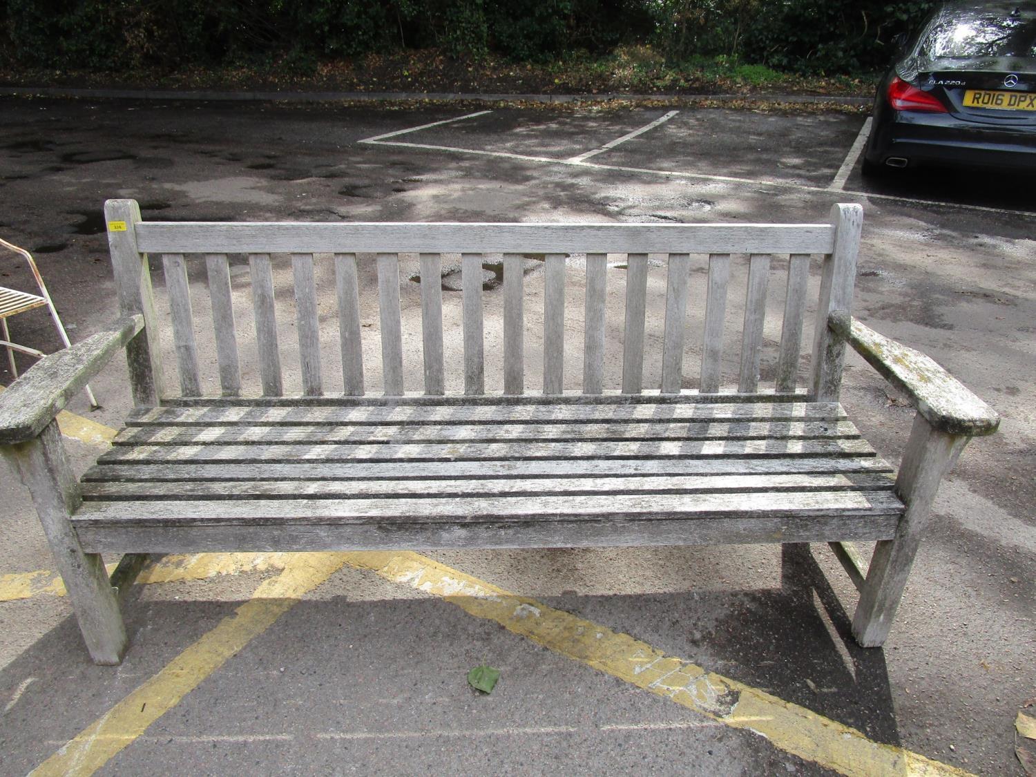 An oak slatted garden bench, 35" x 74" x 24"