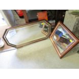 A rectangular eight sided wall mirror with bevelled glass and one other