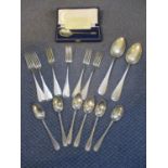 A quantity of German white metal forks and spoons marked 800, together with a British silver