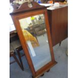 An early 19th century inlaid mahogany wall mirror