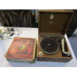 An early 20th century wooden cased wind up gramophone with a selection of 78 rpm records