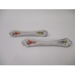 A pair of 19th century Meissen porcelain prism shaped knife rests with faceted corners decorated