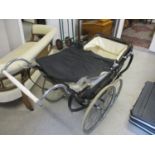 An Osnath pram with spoked wheels
