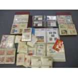 A quantity of First Day covers, a coin cover, mixed postcards and a 1982 Hula Hoops Sporting Medal