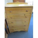 An M & S pine chest of five long drawers