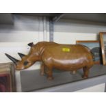 A carved wooden model of a rhino