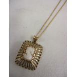 A cameo necklace in a 9ct gold setting