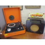 A Bush Bakelite radio and a 1960s orange cased record player and a Max Miller records