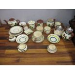 Torquay and Mottoware ceramics to include teacups and saucers, pots and other items