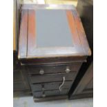 A late 19th century stained pine clerks desk with an angled, hinged top over four drawers, on