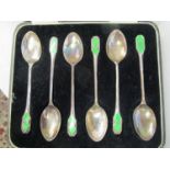 A cased set of six silver enamelled coffee spoons, Birmingham 1934, maker J B Chatterley & Sons,