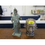 An Asian cast brass/bronze model of a man's head and a patinated brass model of a deity