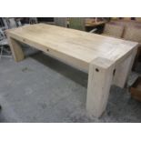 A modern driftwood large dining table on squared block shaped legs 30 1/2"h x 102 1/2"w