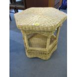 A modern wicker hexagonal, two tier conservatory coffee table