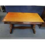 A Victorian mahogany side table with a rectangular top and moulded edge over a cushion moulded