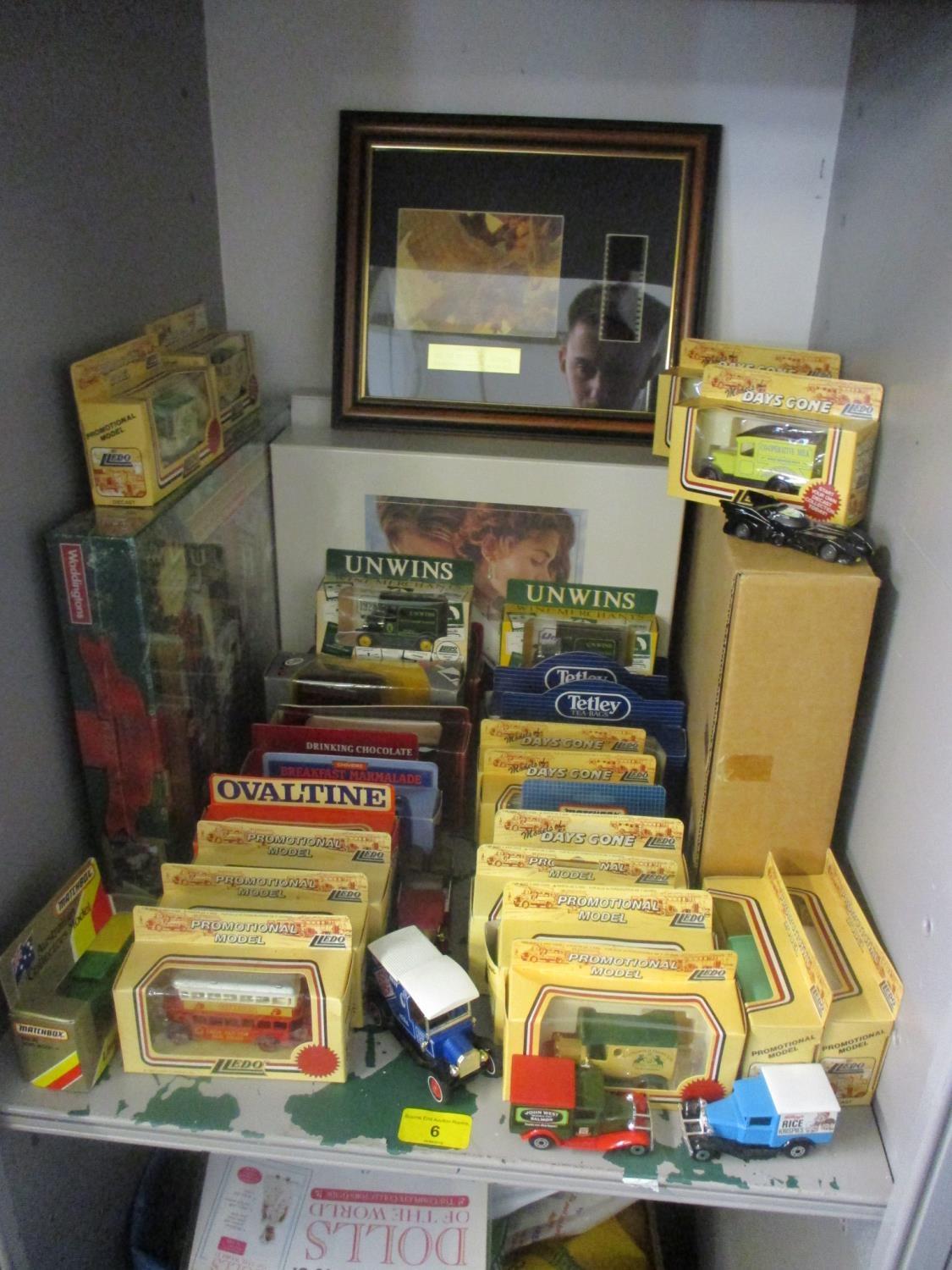 A mixed lot including miniature boxed cars, a Waddington's puzzle, Titanic wide screen collectors