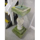 A garden stoneware sundial with patinated brass dial on a stone base, 31 2/8"h