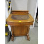 A Victorian walnut Davenport with inlaid string decoration, leather scriber to hinged top, four