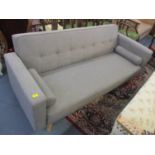 A modern grey sofa bed with removable arms