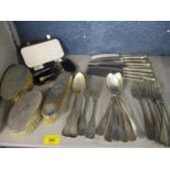 A quantity of silver plated cutlery, together with mixed silver backed dressing table brushes and