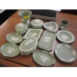 A selection of Wedgwood green Jasperware to include trinket boxes, a vase and mixed earrings