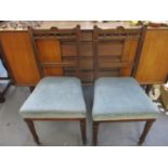 A pair of early to mid 20th century oak dining chairs