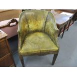 A leather upholstered and mahogany framed tub chair