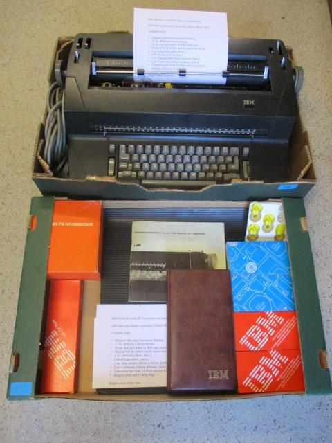 An IBM Selectric model 82 typewriter in mat black, golf ball type electric typewriter, date 28/2/