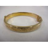 A 9ct gold bangle