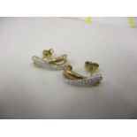 Two 9ct gold and diamond inset earrings