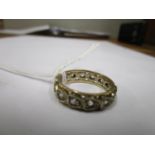 A 9ct gold eternity ring set with white stones