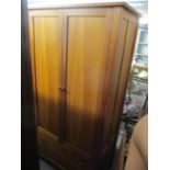 A modern Heals Cherry two door wardrobe with drawers below, 78" h x 41"w