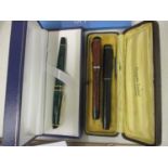 THIS LOT HAS BEEN WITHDRAWN Three pens to include a cased Waterman Golden Platinum and one other