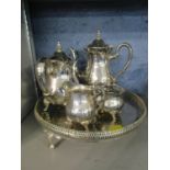 A four piece silver plated teaset with a silver plated tray