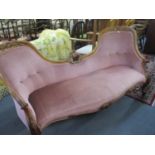 A Victorian double ended chaise longue with pink dralon upholstery