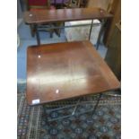 A modern mahogany finished and wrought iron side table with a matching occasional table