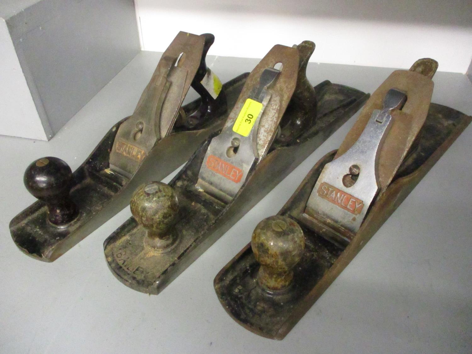 A group of three metal and wood Stanley Ballies No 6 woodworking planes to include one for un-sawn