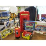 A retro Snoopy table lamp together with diecast vehicles, mixed toys and a telephone housed in a red