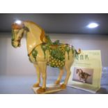 A 20th century Chinese horse with a certificate of authenticity